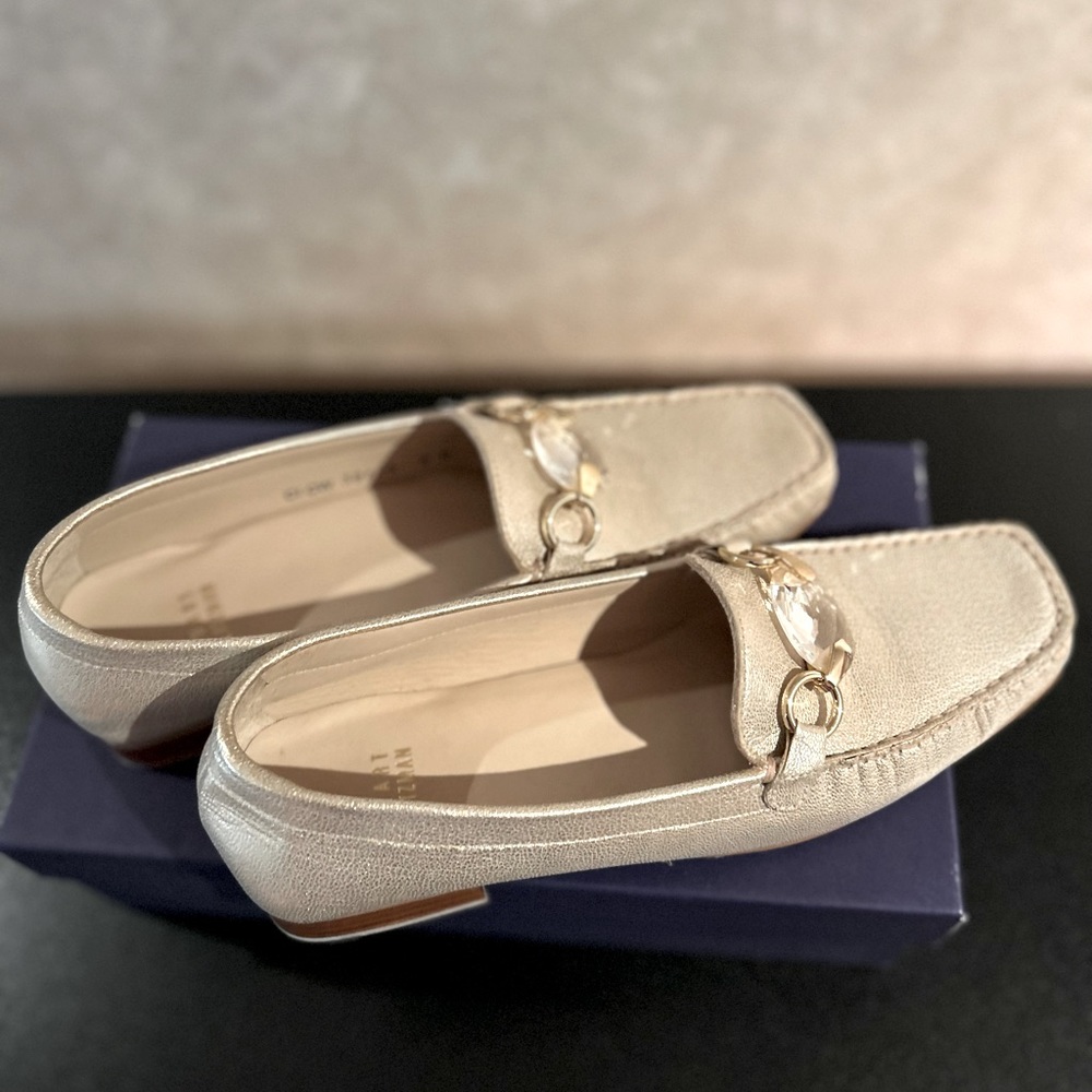 Stuart Weitzman gold moccasins with gold and crystal hardware. Brand new, size 8